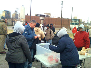 Volunteers serve meals downtown